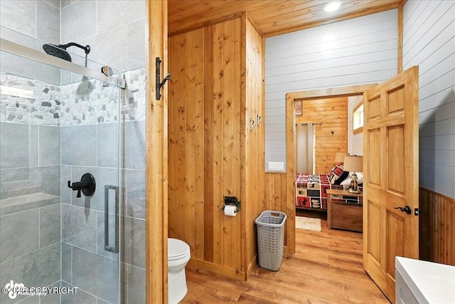 23634 Kasilof River Cir, Kasilof, AK 99610 - full bathroom with wood finished floors, a shower stall, wood walls, and wooden ceiling