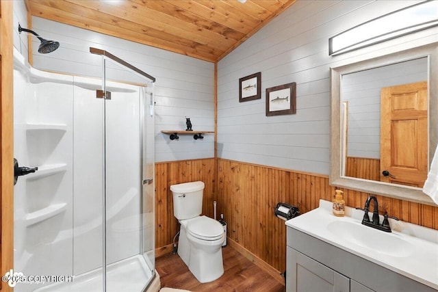 23634 Kasilof River Cir, Kasilof, AK 99610 - bathroom featuring wood walls, a stall shower, vanity, wood finished floors, and wood ceiling