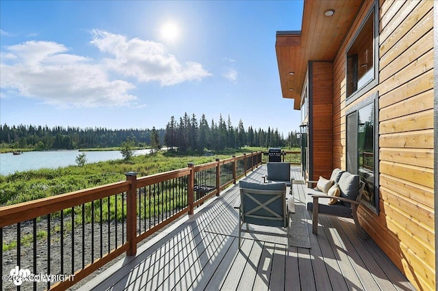 23634 Kasilof River Cir, Kasilof, AK 99610 - wooden terrace with an outdoor hangout area, a water view, and a forest view
