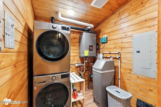 23634 Kasilof River Cir, Kasilof, AK 99610 - laundry room with stacked washer / dryer, electric panel, water heater, wooden ceiling, and wood walls