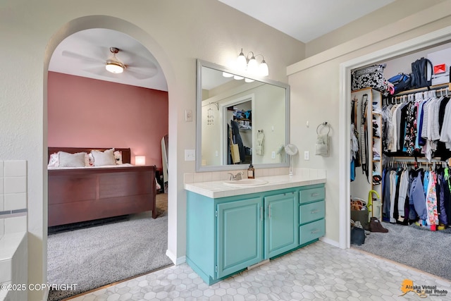 2432 Brook Hill Cir, Anchorage, AK 99516 - bathroom featuring vanity, a ceiling fan, and a spacious closet