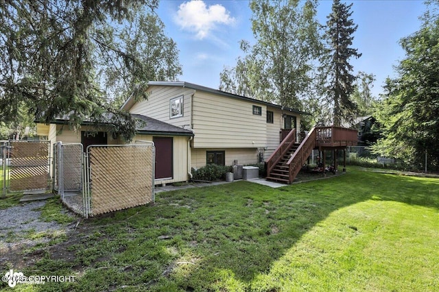 2924 Carnaby Way, Anchorage, AK 99504 - back of house with stairway, a gate, and a deck
