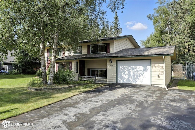 2924 Carnaby Way, Anchorage, AK 99504 - view of front facade with asphalt driveway and an attached garage