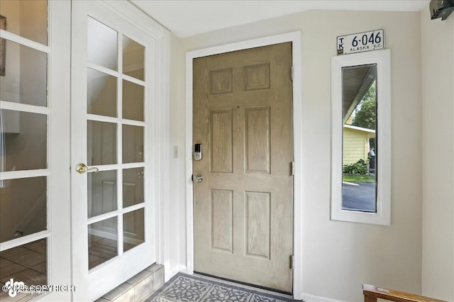 2924 Carnaby Way, Anchorage, AK 99504 - doorway to property with french doors and stucco siding