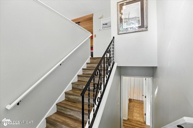 2924 Carnaby Way, Anchorage, AK 99504 - stairway with wood finished floors