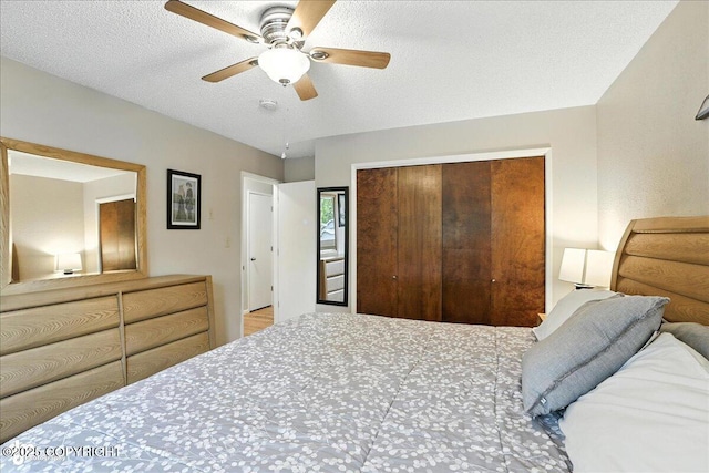 2924 Carnaby Way, Anchorage, AK 99504 - bedroom featuring a closet, a ceiling fan, and a textured ceiling