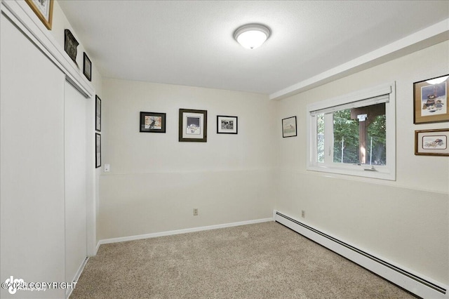 2924 Carnaby Way, Anchorage, AK 99504 - spare room featuring baseboard heating and carpet flooring