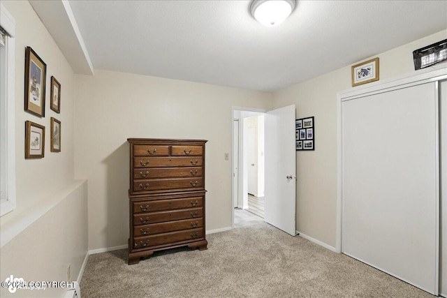2924 Carnaby Way, Anchorage, AK 99504 - carpeted bedroom featuring a closet and baseboards