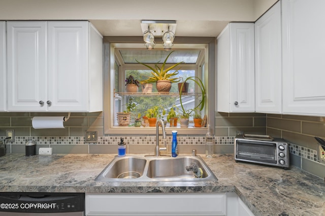 10711 Colville St, Eagle River, AK 99577 - kitchen featuring dishwasher, white cabinetry, and decorative backsplash