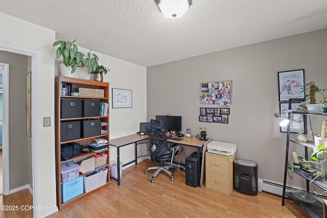 10711 Colville St, Eagle River, AK 99577 - home office with light wood-style flooring and a textured ceiling