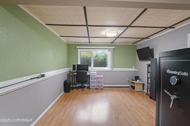 10711 Colville St, Eagle River, AK 99577 - office featuring a baseboard heating unit, a textured wall, wood finished floors, and crown molding