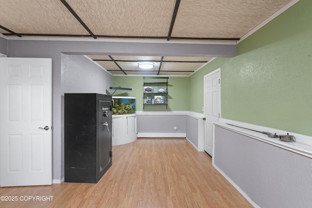 10711 Colville St, Eagle River, AK 99577 - kitchen featuring light wood-style flooring and a textured wall