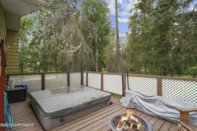 10711 Colville St, Eagle River, AK 99577 - wooden deck featuring an outdoor fire pit