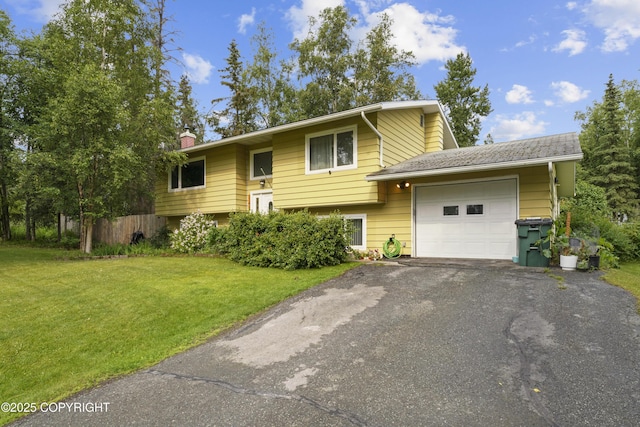 10711 Colville St, Eagle River, AK 99577 - bi-level home featuring an attached garage, a chimney, driveway, and a front yard