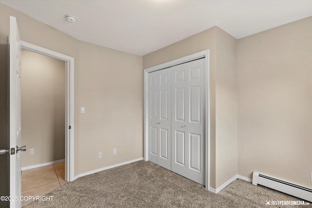 15201 Pollock Dr, Anchorage, AK 99516 - unfurnished bedroom with a baseboard radiator, light carpet, and a closet