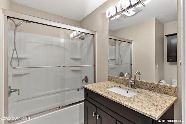 15201 Pollock Dr, Anchorage, AK 99516 - bathroom featuring vanity and bath / shower combo with glass door