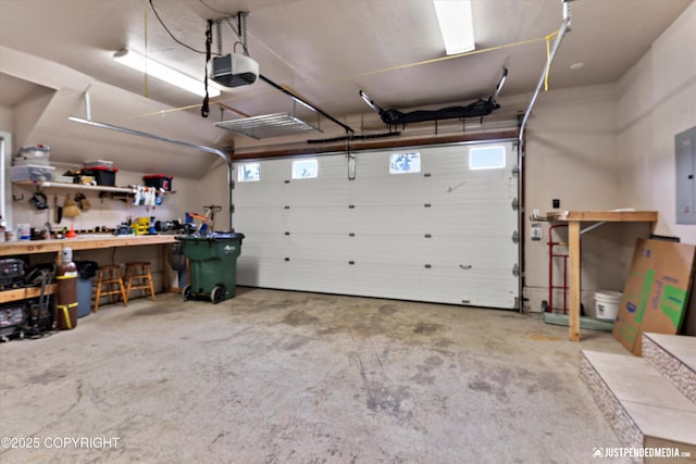 15201 Pollock Dr, Anchorage, AK 99516 - garage with a workshop area, a garage door opener, and electric panel