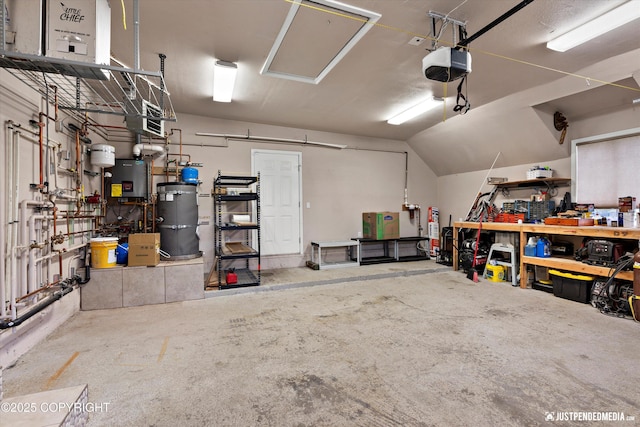 15201 Pollock Dr, Anchorage, AK 99516 - garage with a workshop area, secured water heater, and a garage door opener