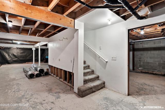 15201 Pollock Dr, Anchorage, AK 99516 - unfinished below grade area featuring stairway