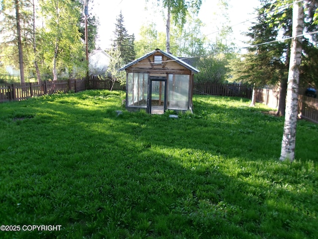 5731 College Dr, Anchorage, AK 99504 - fenced backyard with an exterior structure and an outdoor structure