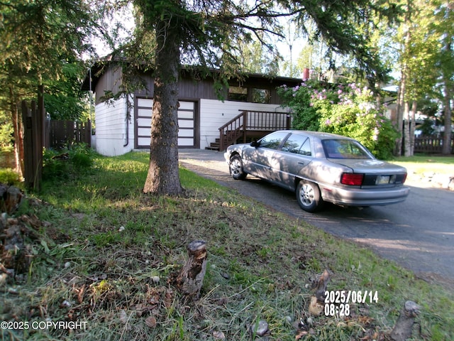 5731 College Dr, Anchorage, AK 99504 - view of side of home featuring a garage