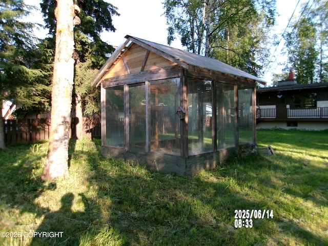 5731 College Dr, Anchorage, AK 99504 - view of greenhouse featuring a yard