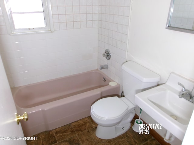 5731 College Dr, Anchorage, AK 99504 - bathroom featuring bathing tub / shower combination and stone finish floors