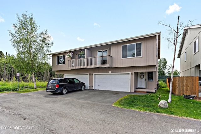 2666 Lauren Creek Loop # 23, Anchorage, AK 99507 - view of property with driveway and a garage