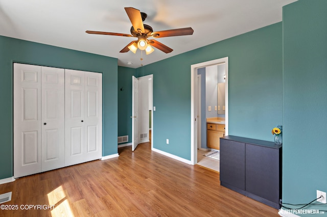 2666 Lauren Creek Loop # 23, Anchorage, AK 99507 - unfurnished bedroom featuring wood finished floors, a closet, ceiling fan, and ensuite bathroom