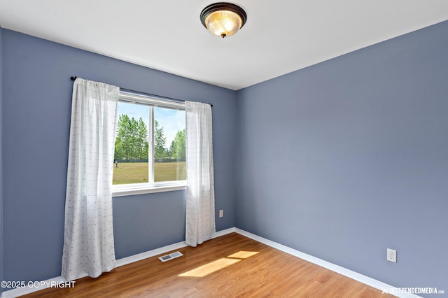2666 Lauren Creek Loop # 23, Anchorage, AK 99507 - unfurnished room featuring baseboards and wood finished floors