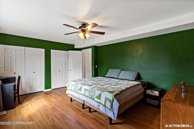 2666 Lauren Creek Loop # 23, Anchorage, AK 99507 - bedroom with wood finished floors, two closets, and a ceiling fan