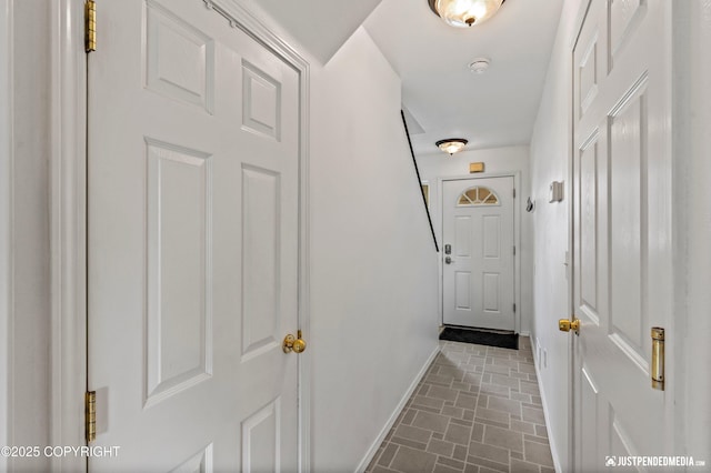 2666 Lauren Creek Loop # 23, Anchorage, AK 99507 - doorway with baseboards and brick patterned floors