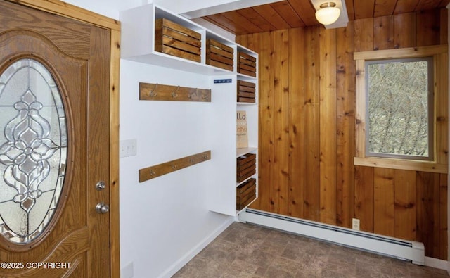 8011 Stewart Mountain Dr, Eagle River, AK 99577 - entrance foyer featuring a baseboard heating unit, wooden ceiling, and wooden walls