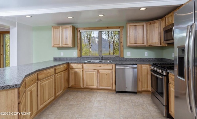 8011 Stewart Mountain Dr, Eagle River, AK 99577 - kitchen with stainless steel appliances, healthy amount of natural light, dark countertops, a peninsula, and recessed lighting