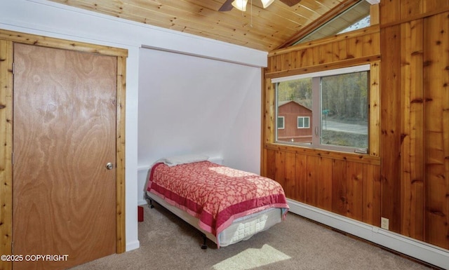8011 Stewart Mountain Dr, Eagle River, AK 99577 - carpeted bedroom with a baseboard heating unit, vaulted ceiling, wooden ceiling, and wooden walls