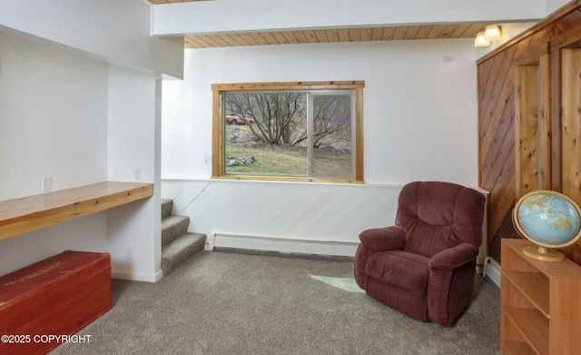 8011 Stewart Mountain Dr, Eagle River, AK 99577 - sitting room with a baseboard heating unit, carpet, a wood ceiling with exposed beams, wood walls, and stairway
