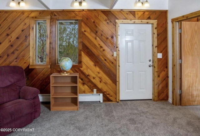 8011 Stewart Mountain Dr, Eagle River, AK 99577 - carpeted living room featuring a baseboard heating unit and wood walls