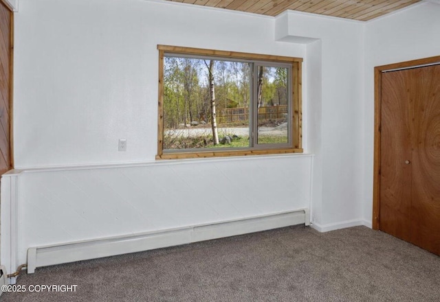 8011 Stewart Mountain Dr, Eagle River, AK 99577 - empty room with a baseboard radiator, carpet, and wood ceiling
