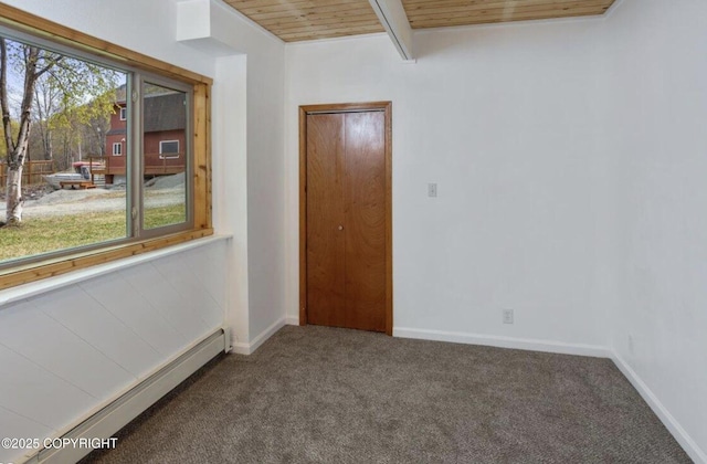8011 Stewart Mountain Dr, Eagle River, AK 99577 - carpeted empty room featuring a baseboard radiator and a wood ceiling with exposed beams