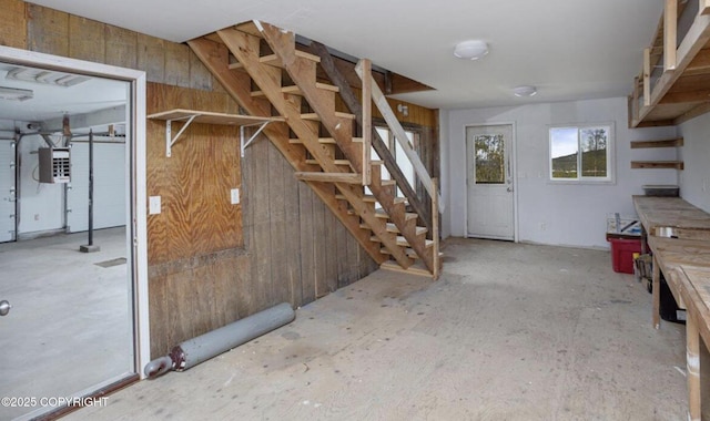 8011 Stewart Mountain Dr, Eagle River, AK 99577 - basement with wooden walls, stairway, and electric panel