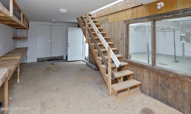 8011 Stewart Mountain Dr, Eagle River, AK 99577 - basement featuring stairs and wood walls