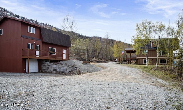 8011 Stewart Mountain Dr, Eagle River, AK 99577 - view of dirt / gravel driveway featuring a mountain view