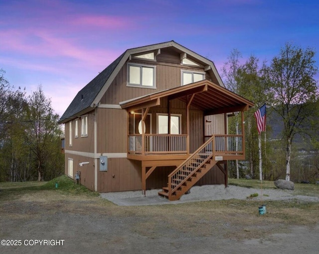 8011 Stewart Mountain Dr, Eagle River, AK 99577 - view of front of property with a porch, stairs, and roof with shingles