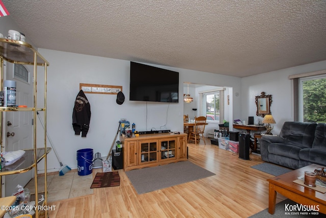 203 S Cobb St, Palmer, AK 99645 - living room featuring a textured ceiling and wood finished floors