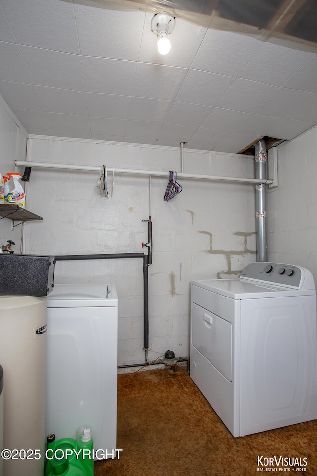 203 S Cobb St, Palmer, AK 99645 - laundry room with washing machine and dryer, concrete block wall, water heater, and carpet flooring