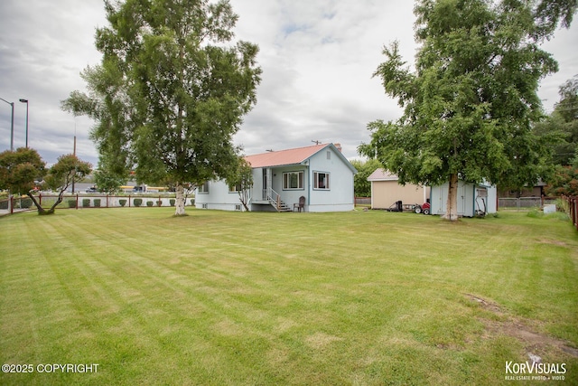 203 S Cobb St, Palmer, AK 99645 - view of yard with an outdoor structure and entry steps