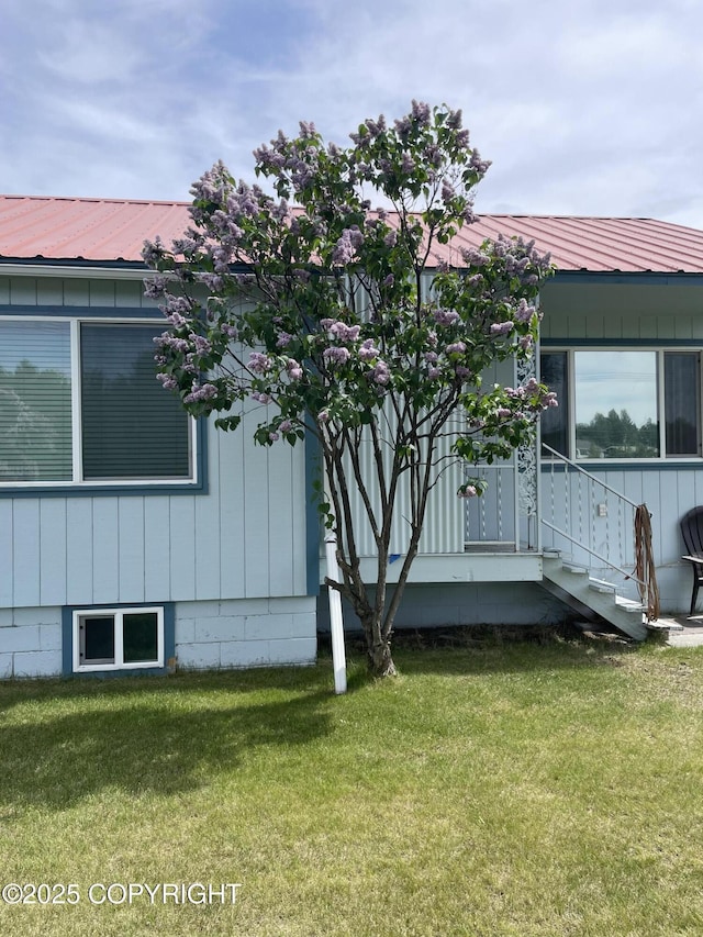 203 S Cobb St, Palmer, AK 99645 - view of side of home with a lawn and a metal roof