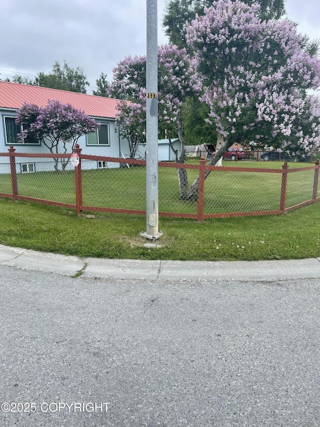 203 S Cobb St, Palmer, AK 99645 - view of front of home with a fenced front yard and a metal roof