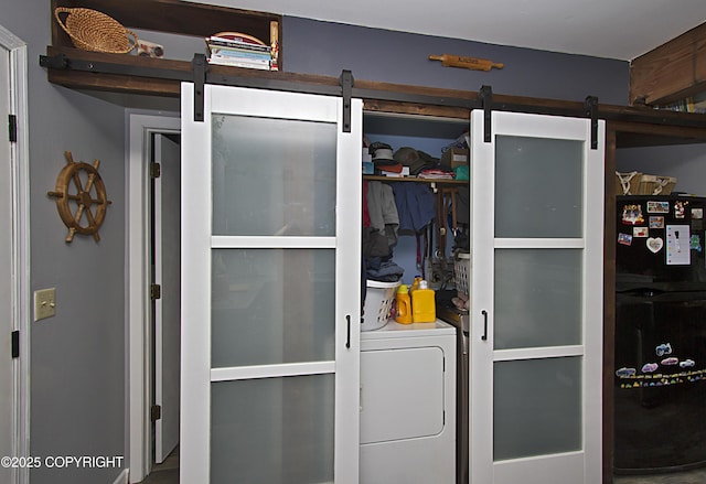 213 Lee Dr, Homer, AK 99603 - washroom featuring washer / dryer and a barn door