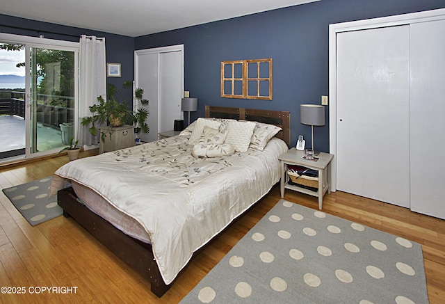 213 Lee Dr, Homer, AK 99603 - bedroom featuring access to exterior and wood finished floors